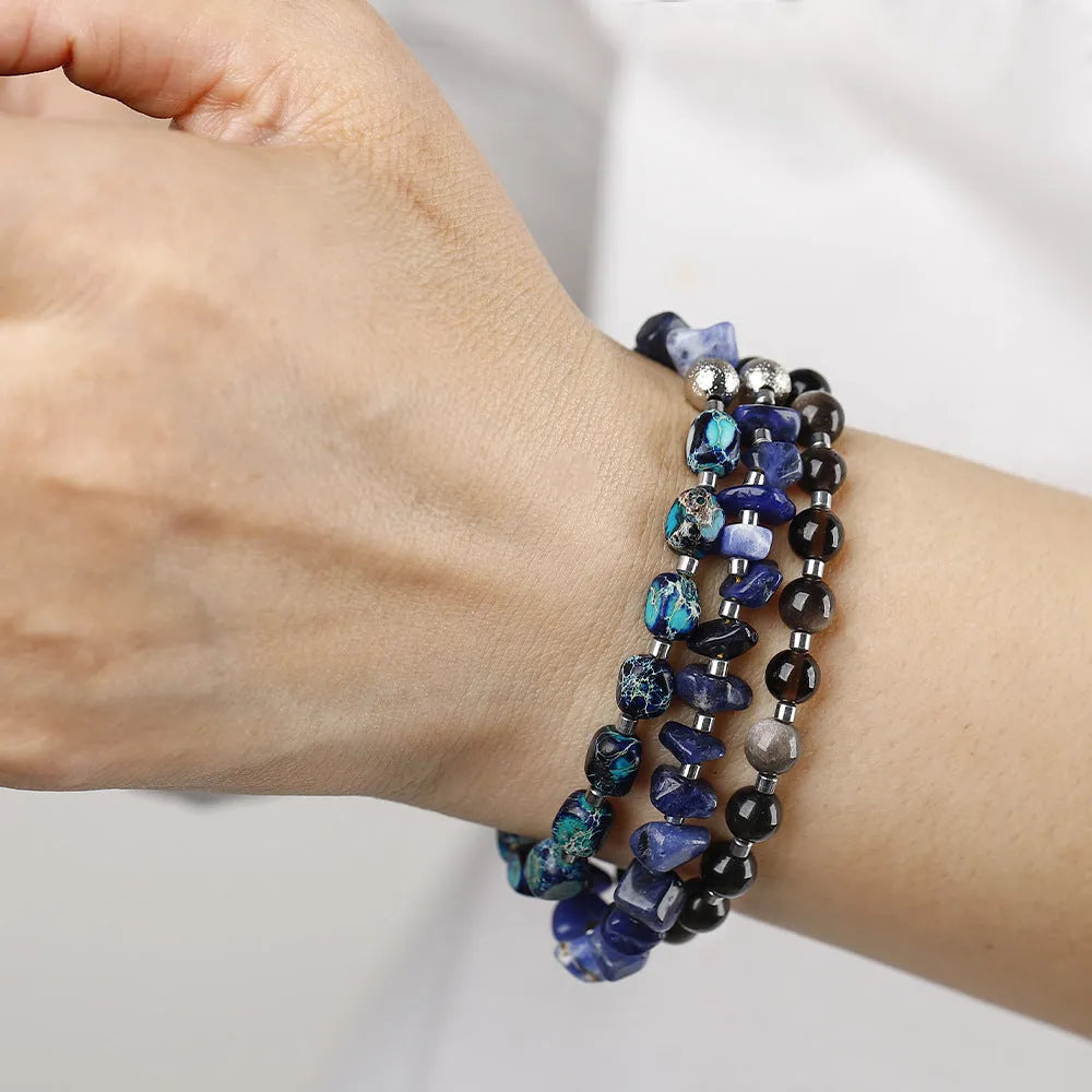 Female retro multi-layer hand woven crushed stone bracelet in blue with Fang Hui stone and gold Obsidian beads
