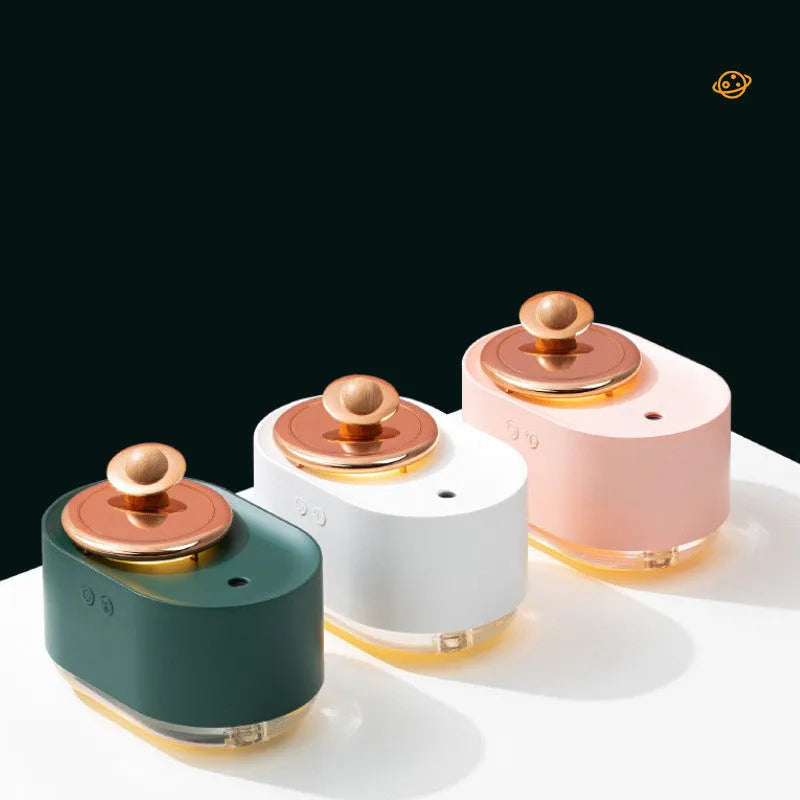 Green rotating planet-shaped USB humidifier with night light on wooden surface