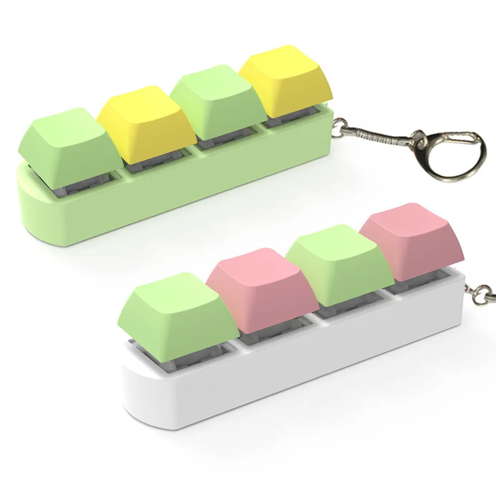 4-key mechanical shaft tester decompression toy with transparent bottom shell and coloured key caps.