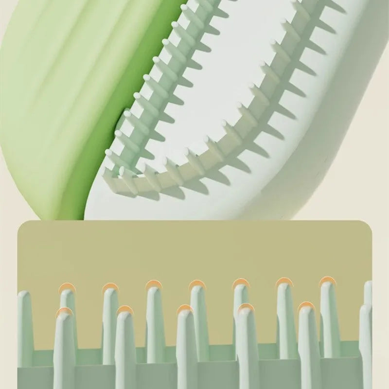 Blue pet grooming comb with integrated water tank and cleaning brush on a white background.