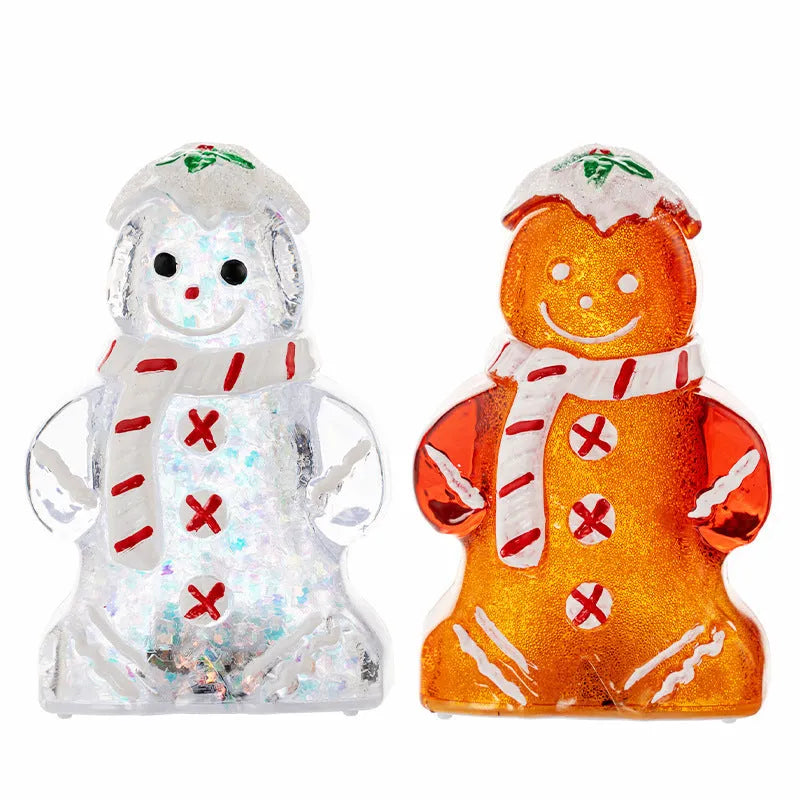 Glowing LED gingerbread man snowman Christmas ornament with a red scarf on a festive tree.