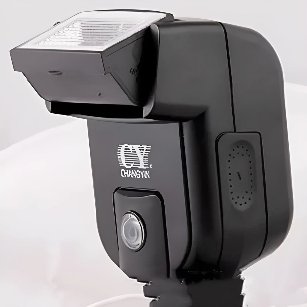 Silver hot shoe camera flash with head tilted upwards, shown mounted on an SLR camera.