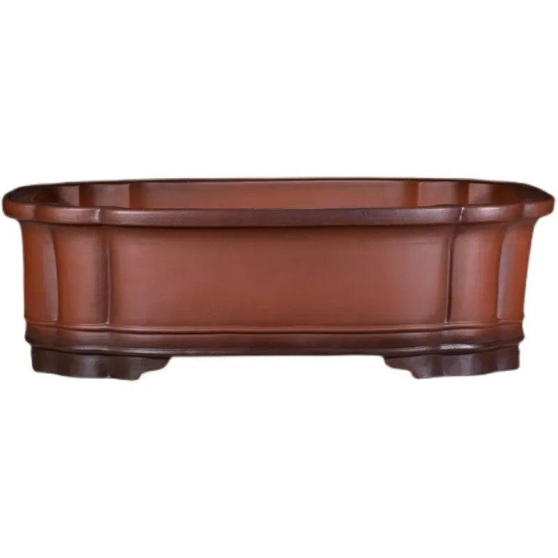 Large antique-style purple clay flowerpot with Chinese design for outdoor garden use.