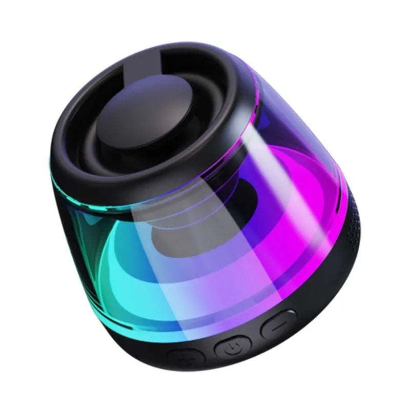 Black and white portable Bluetooth speaker with ambient lighting and magnetic base