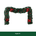 Christmas rattan wreath decoration with pine cones and red bow on green background