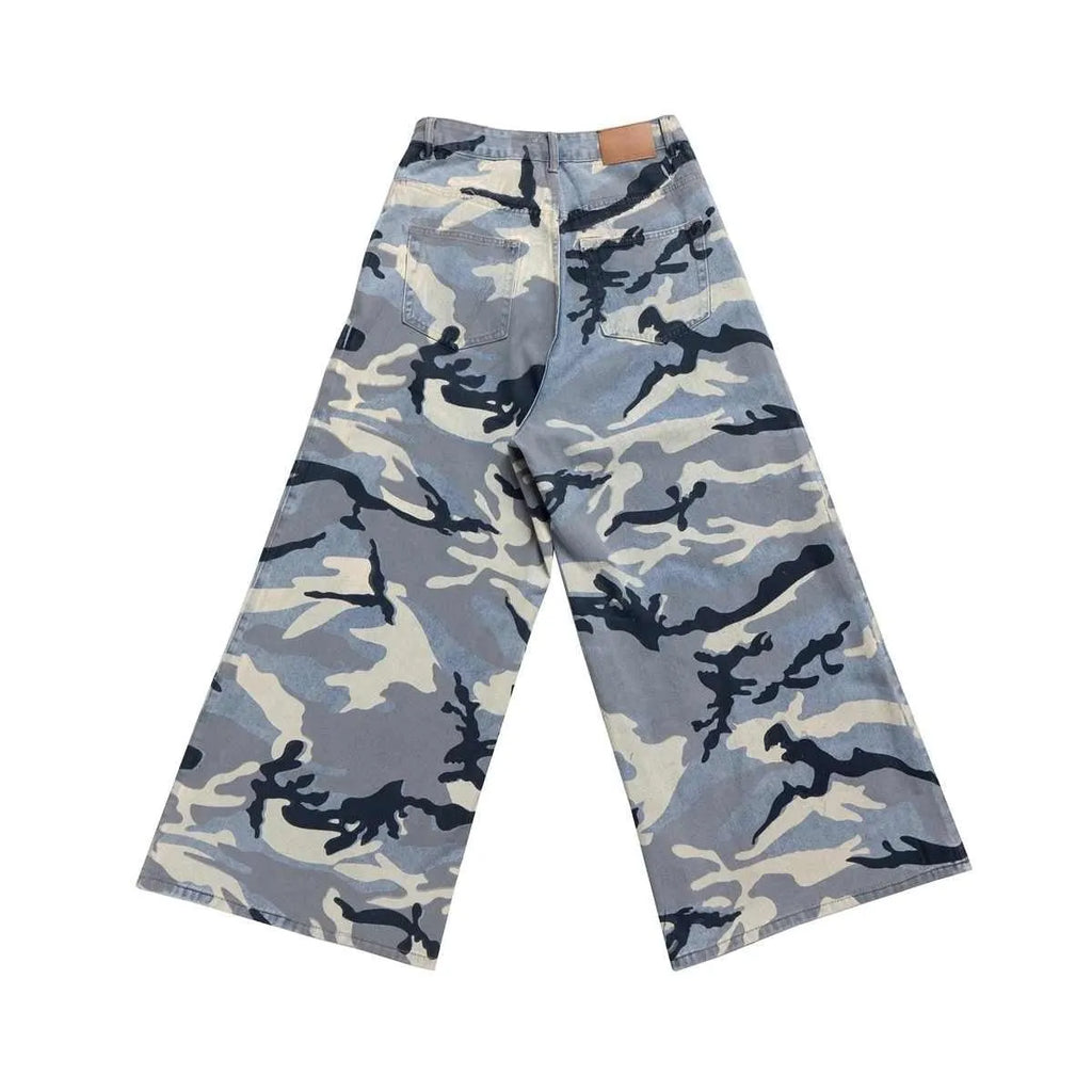 Snow camouflage blue loose-fit denim jeans with a mid-waist, shown on a hanger.