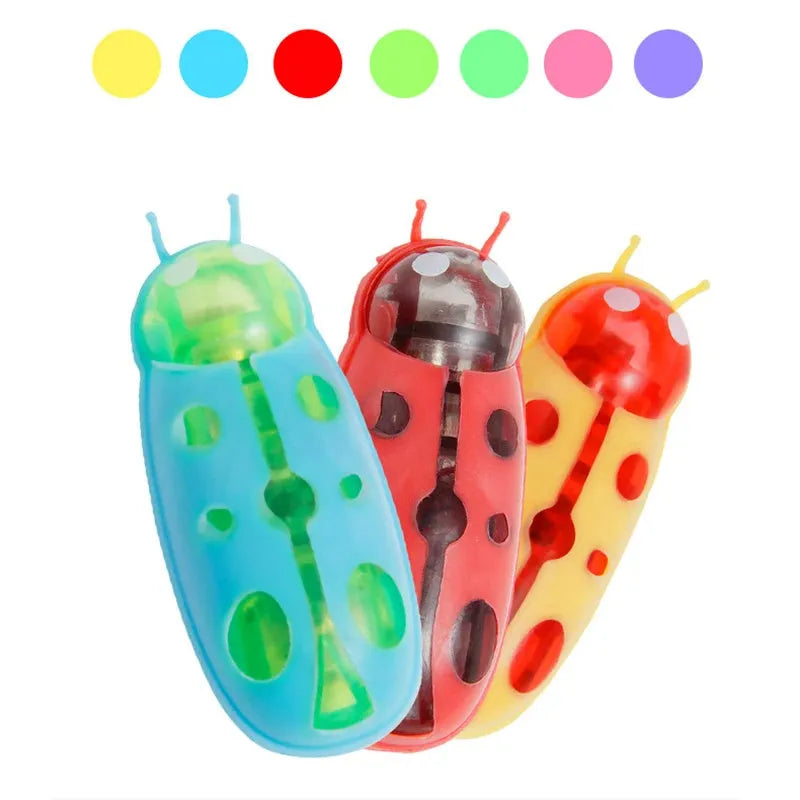 Mini electric bug toy for cats, ladybird style, crawling on a floor with green colour and PVC body