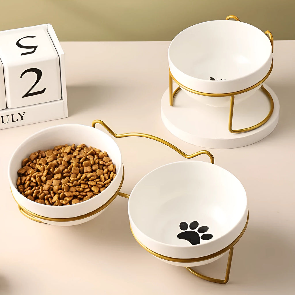 White ceramic cat bowl with decorative iron frame in cat footprints or fishbone design