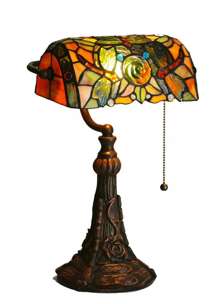 10-inch Tiffany desk lamp with coloured stained glass shade and resin base on a wooden table.