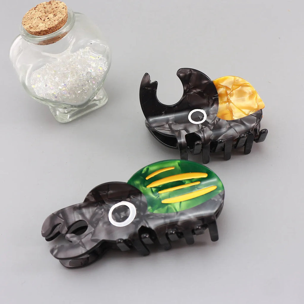 Handmade cellulose acetate beetle grip in green colour with cartoon design