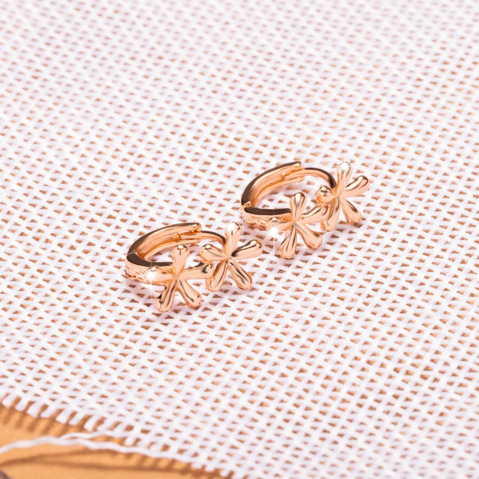 Circular rose gold electroplated earrings with waterdrop flower design for women
