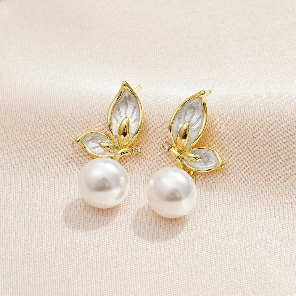 Gold-coloured butterfly earrings with zircon painting detail on copper metal for women