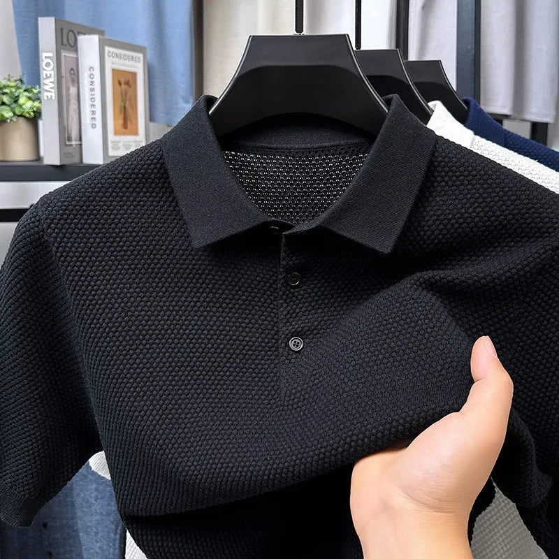 Man wearing a loose grey cotton short sleeve pullover sweater for casual leisure.