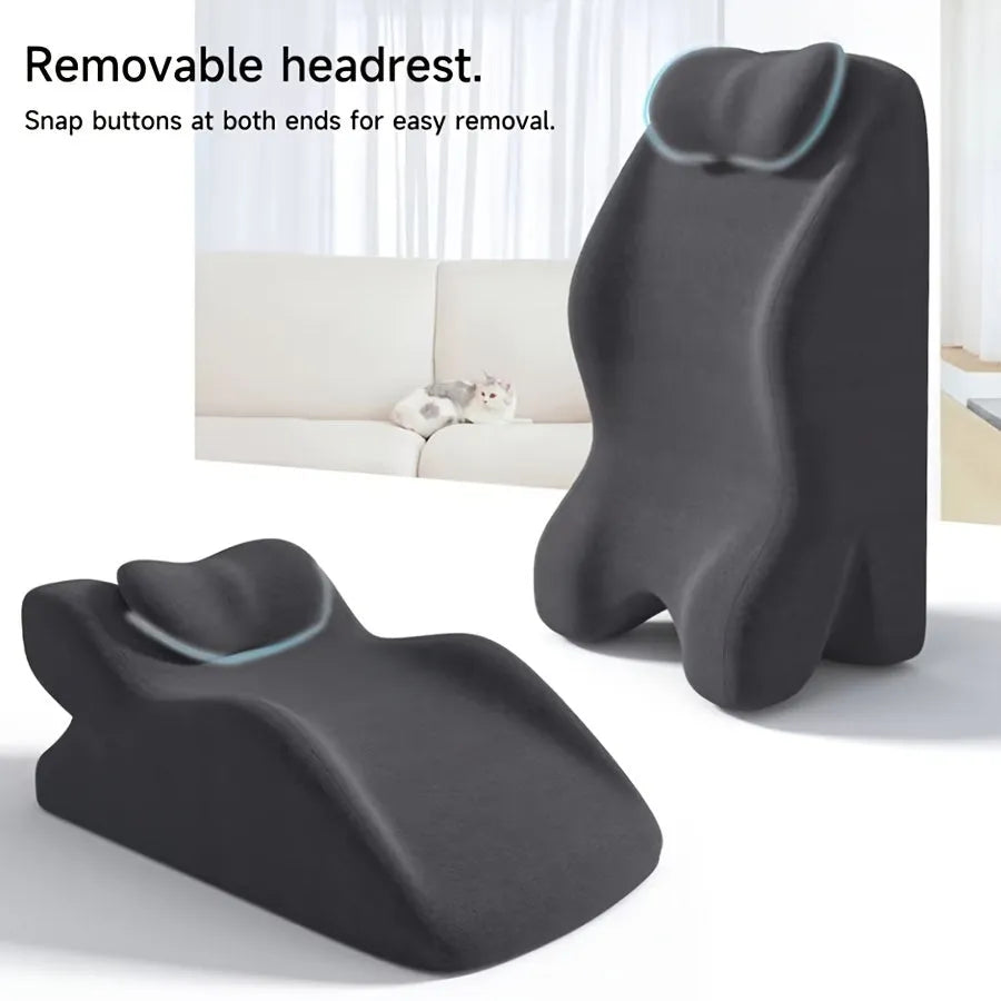 A stomach sleeper pillow in blue, designed for prone positioning and reading in bed.