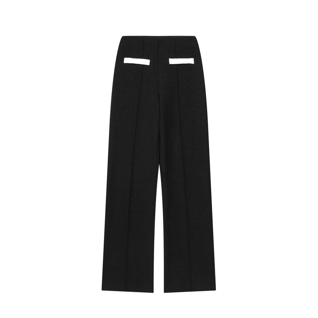 Street fashion trousers suit showing round neck top and high-waisted trousers in casual pants colour