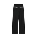 Street fashion trousers suit showing round neck top and high-waisted trousers in casual pants colour