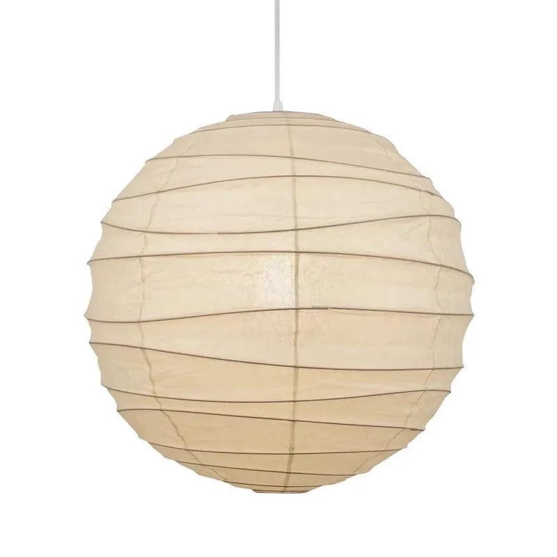 Japanese style rice paper pendant chandelier hanging from a ceiling, providing soft ambient light.