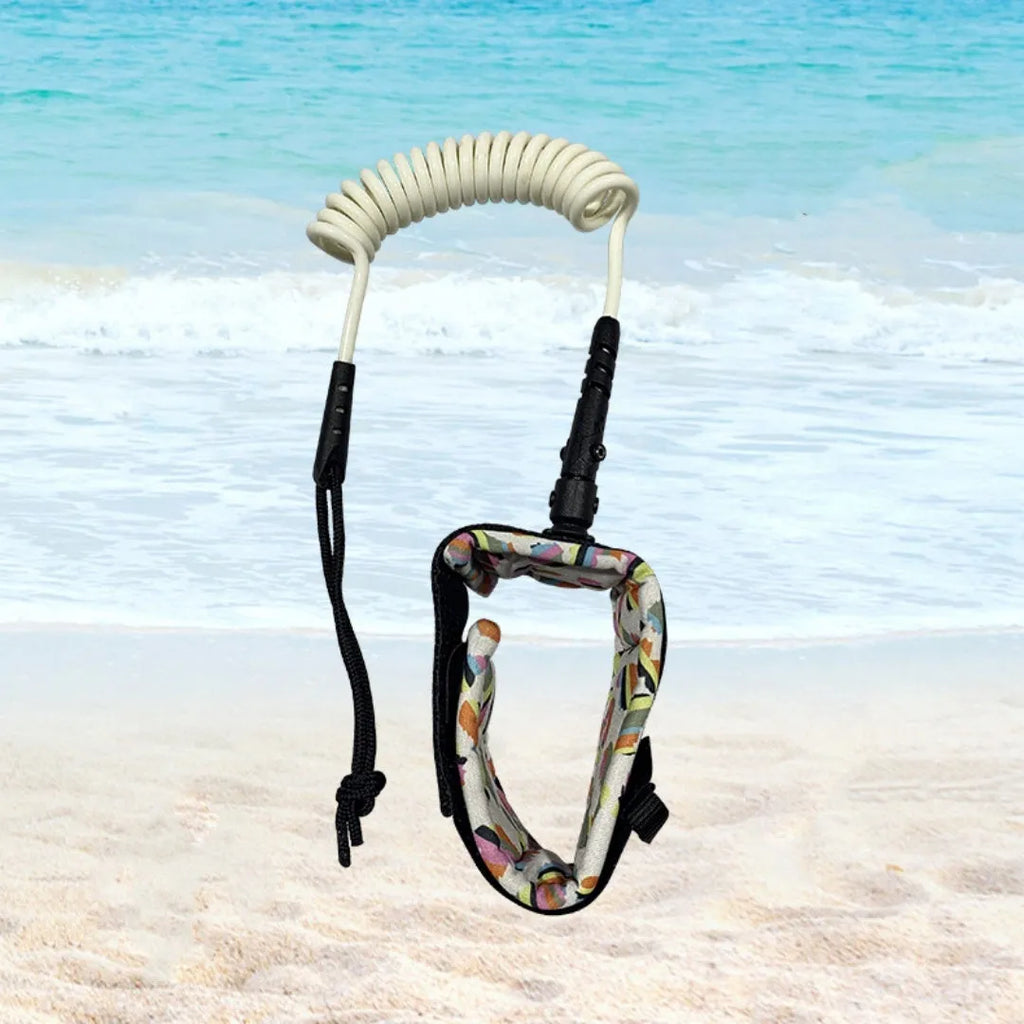 Surfboard hand holding rope made of beige pulp material coiled on a wooden surface
