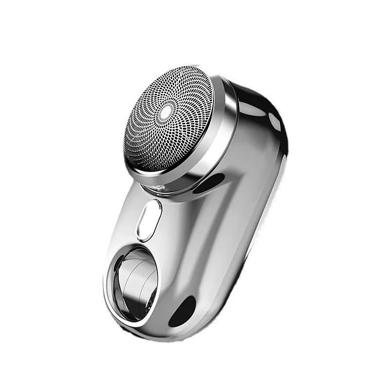 Silver travel waterproof mini electric shaver with rotary head and LED display on white background