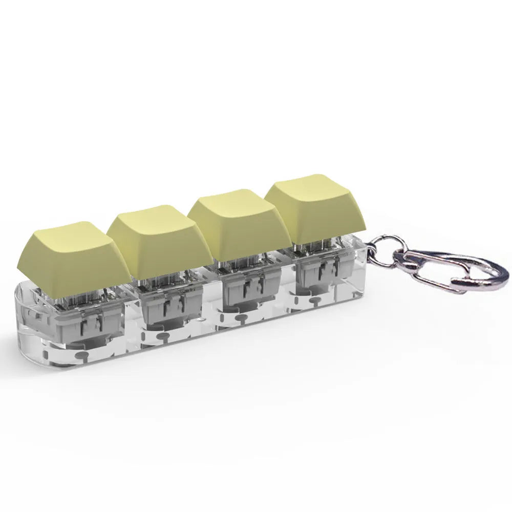 4-key mechanical shaft tester decompression toy with transparent bottom shell and coloured key caps.