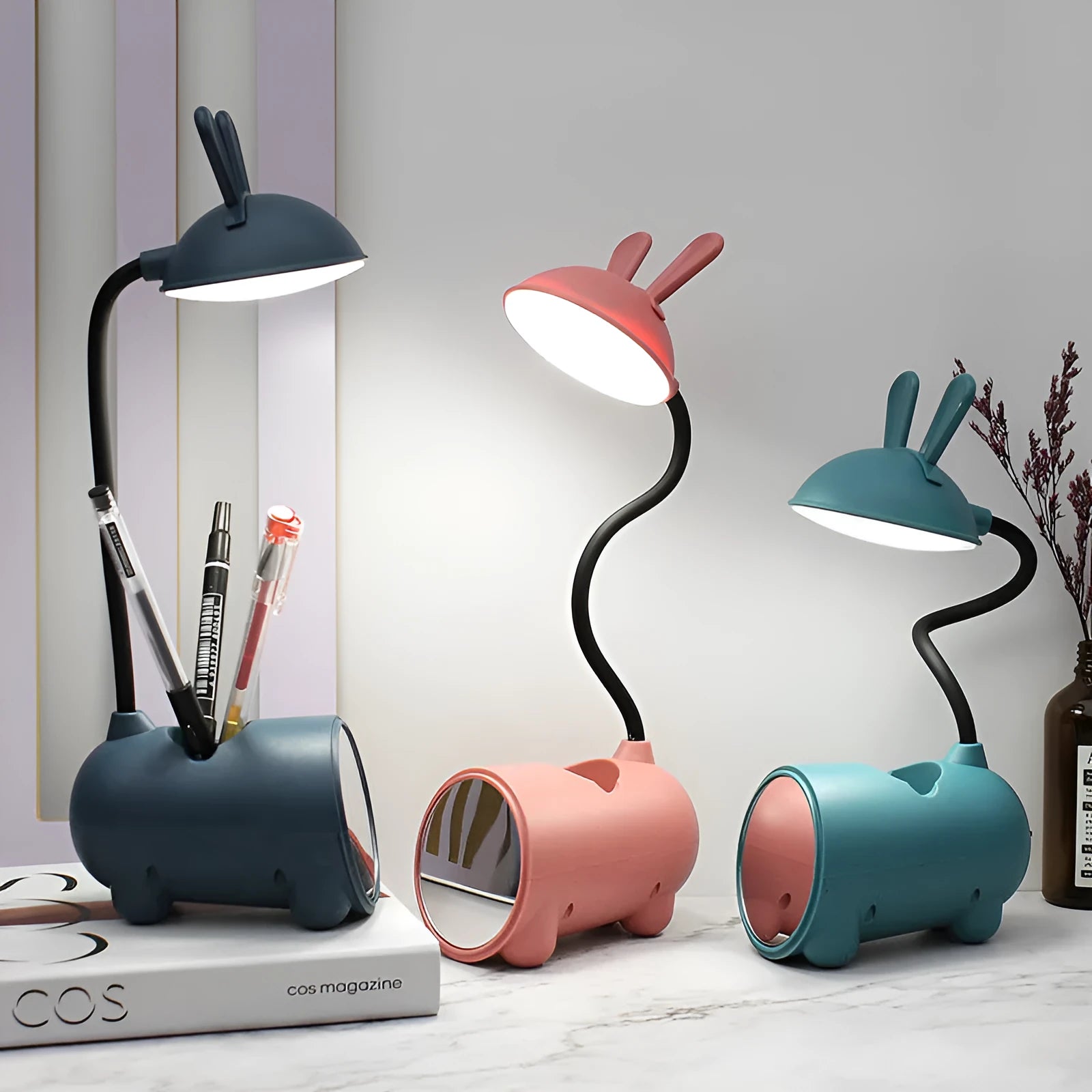 Cartoon-themed USB table lamp with pen container in green colour on desk
