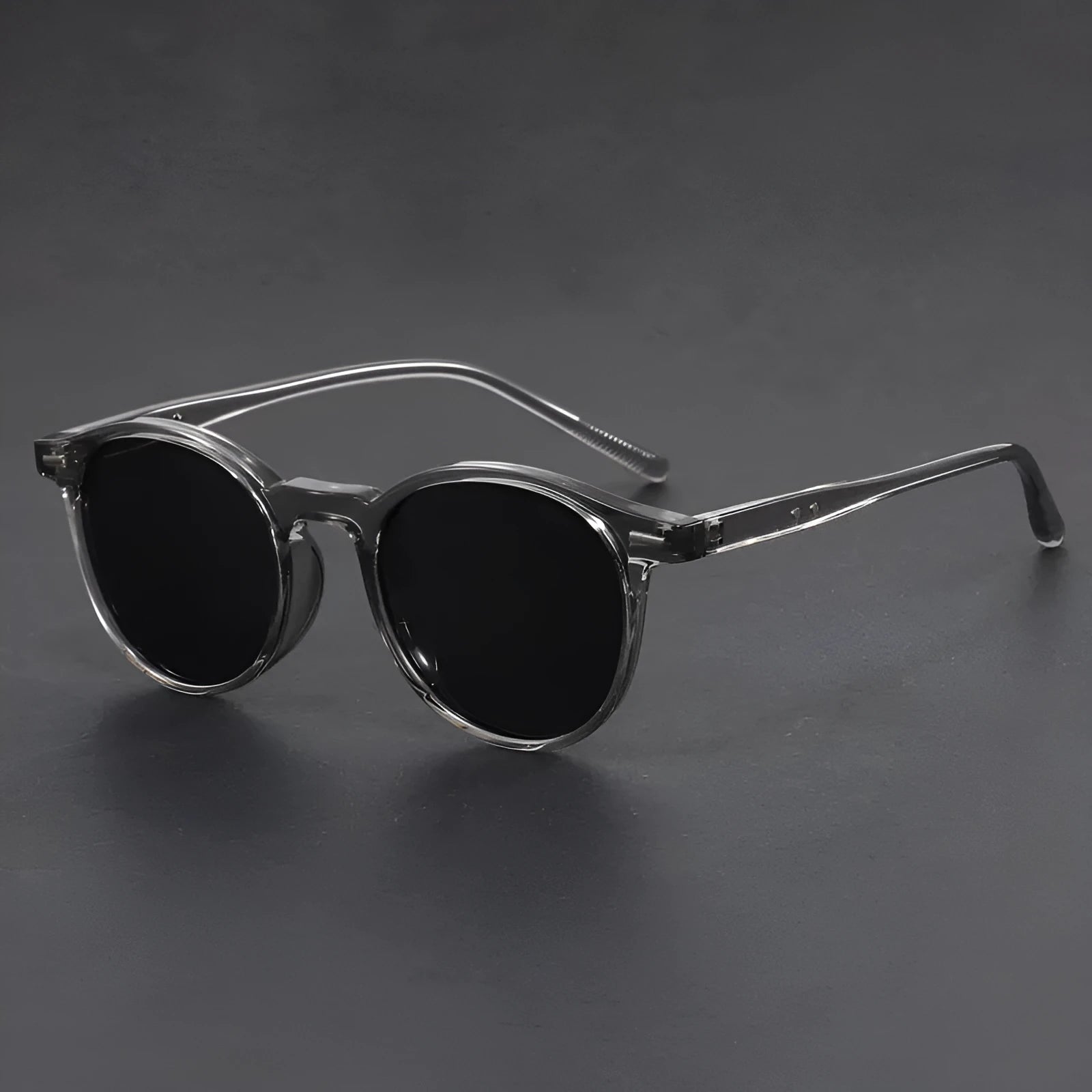 Ultra-light round frame retro sunglasses with polarised gray lenses in multiple colours including sand black, bright black, and gray