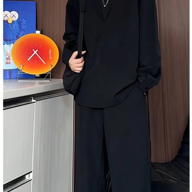 Men's black casual two-piece suit with long sleeve polo shirt and matching trousers