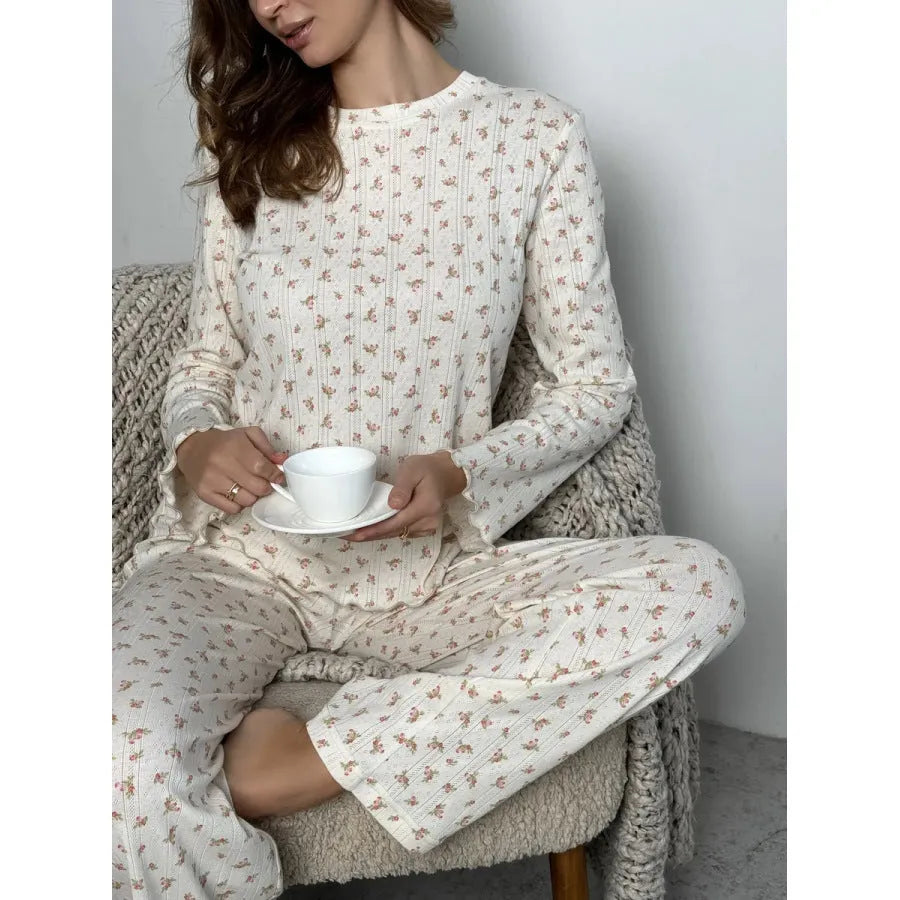 White floral print women's loungewear suit with bell sleeve top and wide-leg trousers