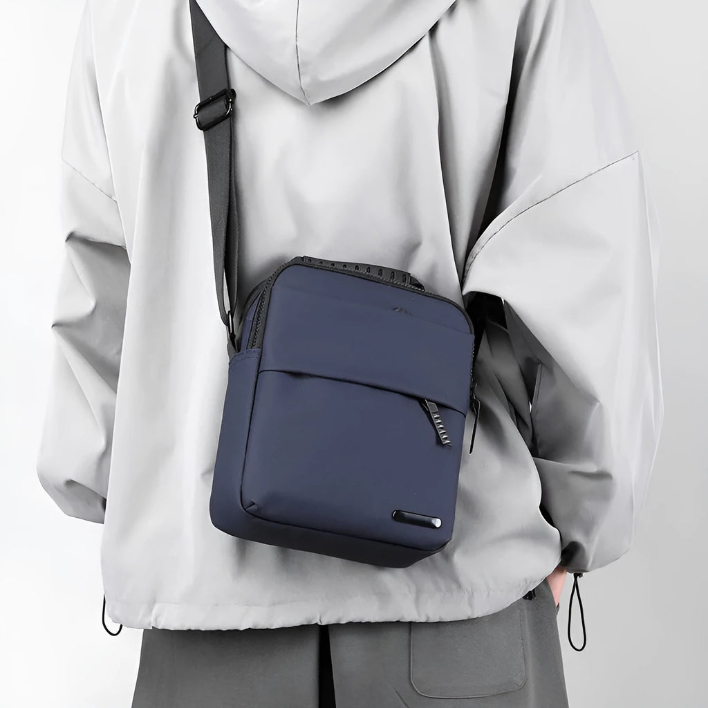 Men's waterproof crossbody bag in army green with PU leather exterior and sewing line detail
