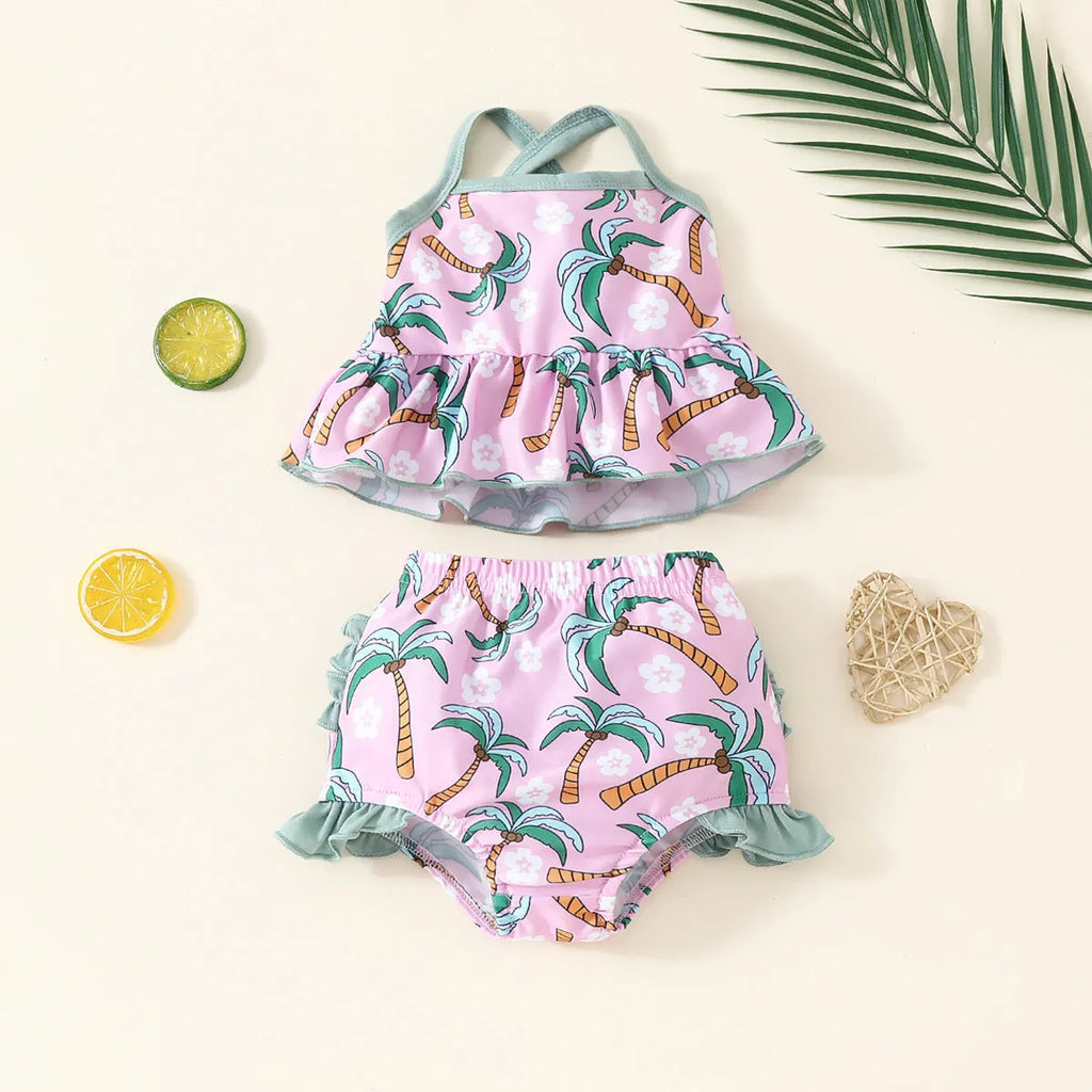White children's two-piece swimsuit set comprising a top and shorts made from polyester.