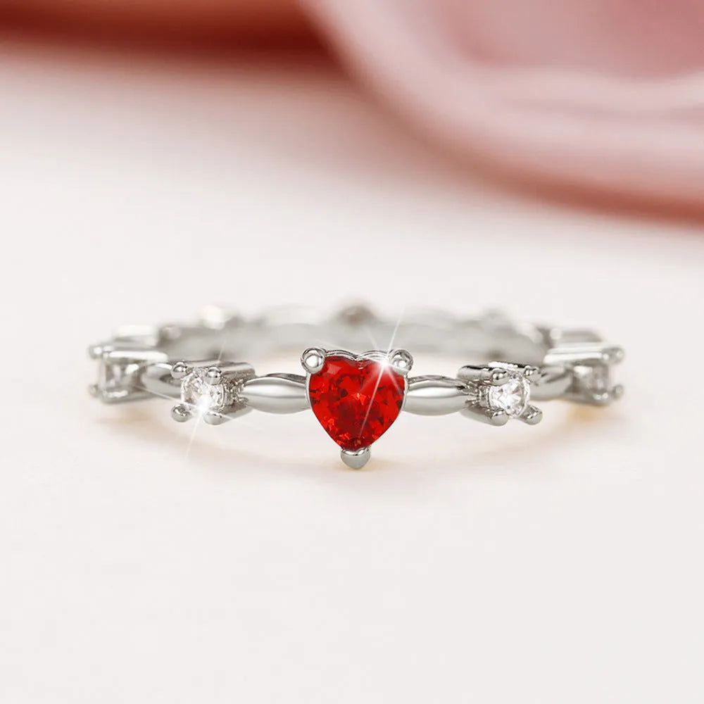 Copper zircon peach heart ring in gold on hand, unisex size