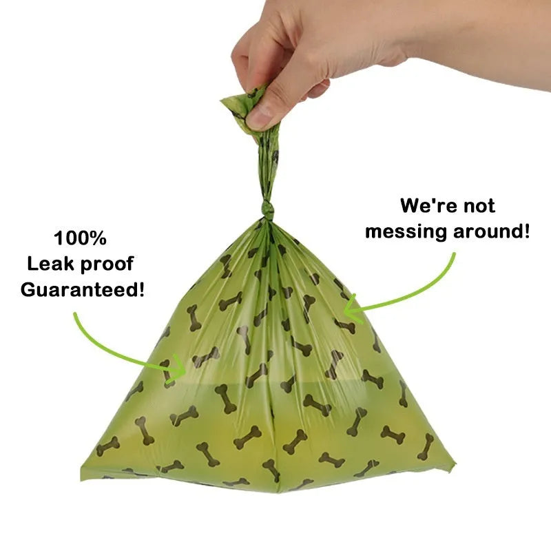 Degradable dog waste bags in army green with black bone printing, showing roll and individual bag