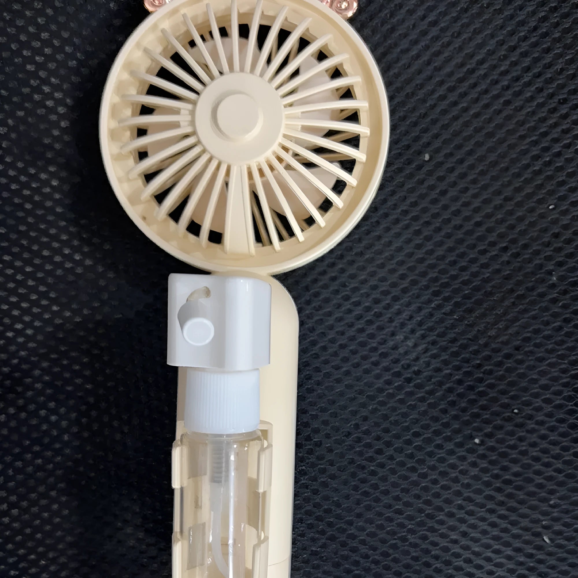 USB-powered plastic personal nozzle fan in choice of colours: apricot, blue, green, orange, pink.