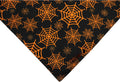 Reversible Halloween dog bandana with pumpkin and spider web patterns in black and orange, 65 x 45 x 45 cm