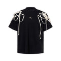 Black loose fit t-shirt with rivet ribbon padded shoulders and round neck collar