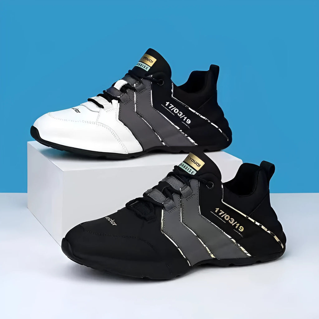 Low-top casual sneaker with thick plastic sole and mesh lining in grey and black colourway.