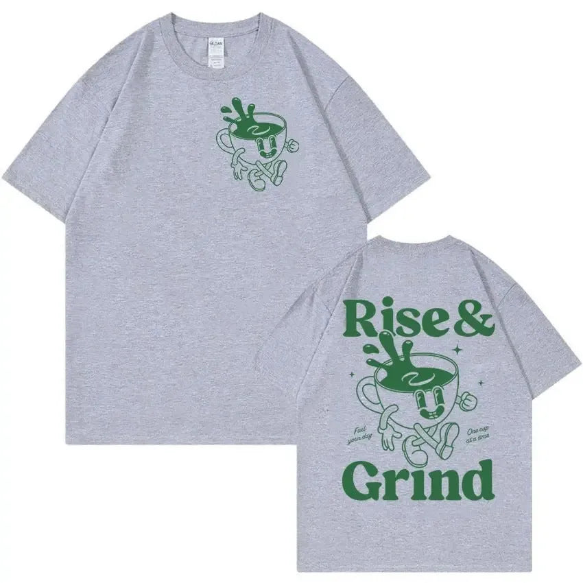 Front view of a loose-fit linen T-shirt featuring a printed 'Rise And Grind Green Coffee' cartoon design in black on a light-coloured fabric.