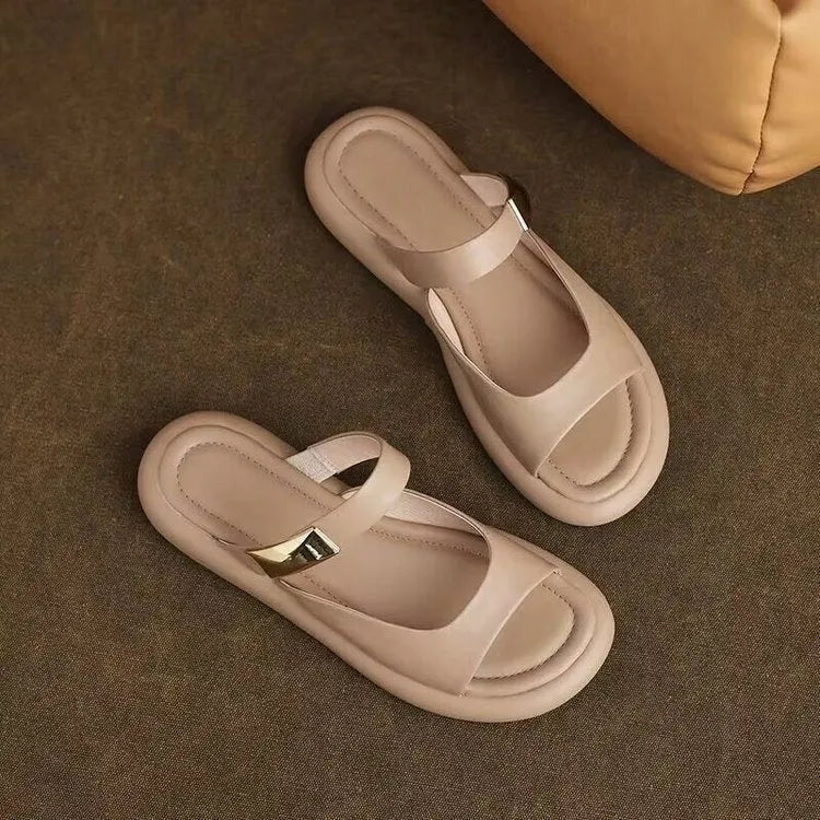 Apricot peep toe flat sandals with a platform sole and leather upper