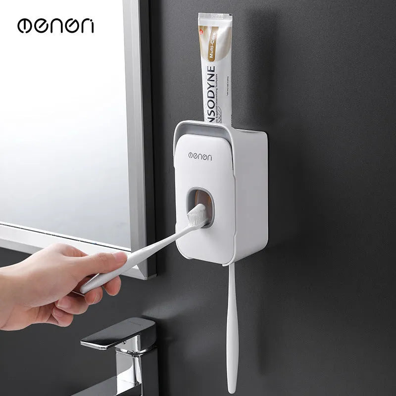 Automatic toothpaste dispenser unit in blue, grey, and pink colours made from ABS plastic.