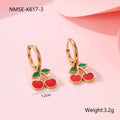 Four-piece cherry-themed jewellery set with gold electroplated necklace, bracelet, earrings, and ring on a white background.