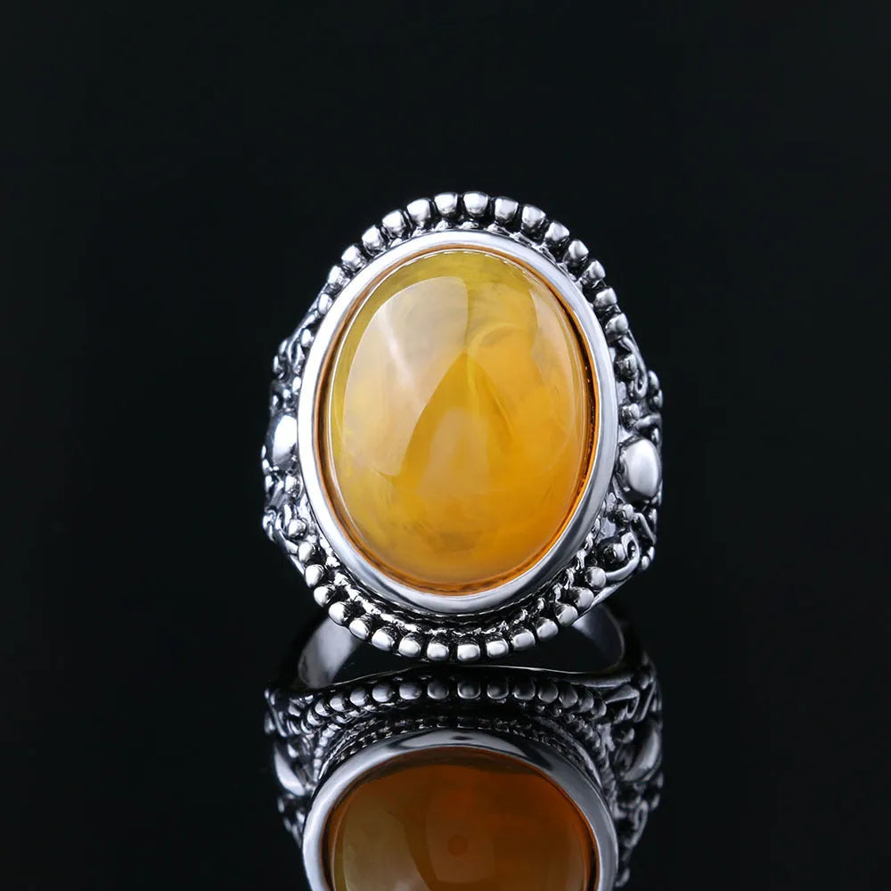 Geometric alloy ring with fluorescent beeswax plating in antique silver amber finish