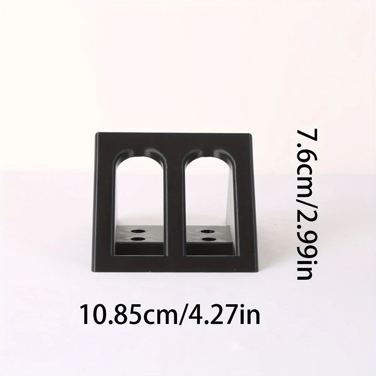 Black plastic punk-style pistol stand for displaying decorative firearms