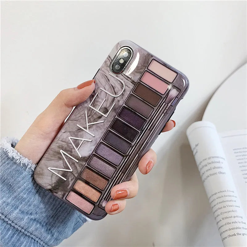 Silicone phone case with eye shadow design for iPhone, shown in flesh and grey colours.
