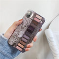 Silicone phone case with eye shadow design for iPhone, shown in flesh and grey colours.