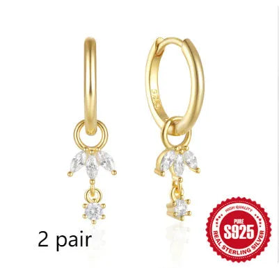 S925 sterling silver earrings with a geometric sunflower design and inlaid zircon stones in a golden colour.