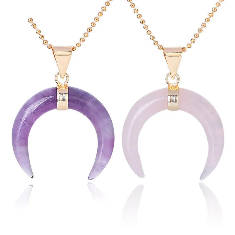 Close-up of a natural stone moon pendant necklace with electroplated copper chain.