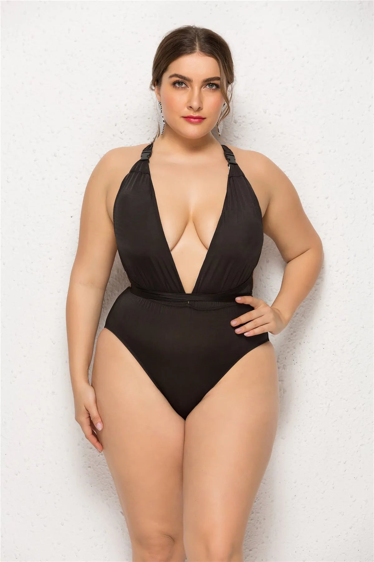 Plus size woman in black high elasticity backless one-piece swimsuit with chest pad solid colour for swimming fitness