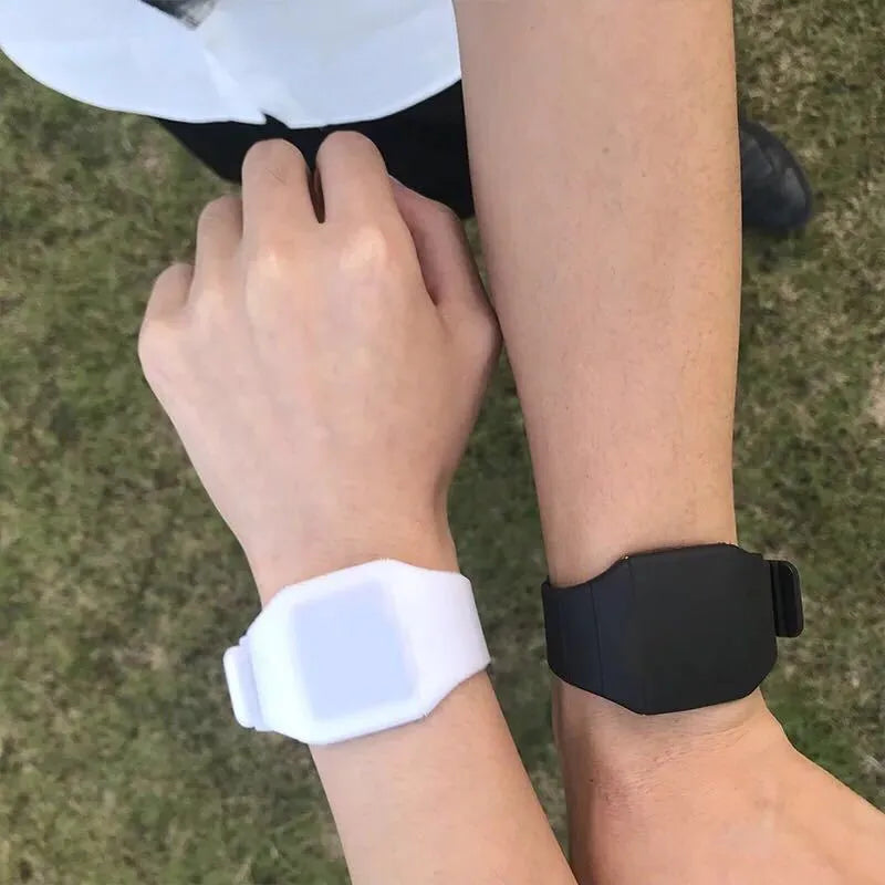 Square digital electronic watch with touch screen on a coloured PU strap.