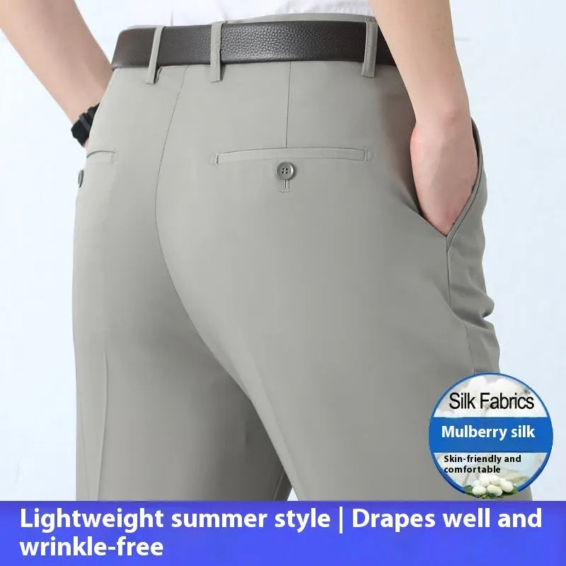 Man wearing dark blue straight-leg mulberry silk blend suit trousers with a high waist.