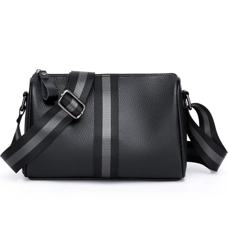 Black genuine leather crossbody bag showing front view with single shoulder strap